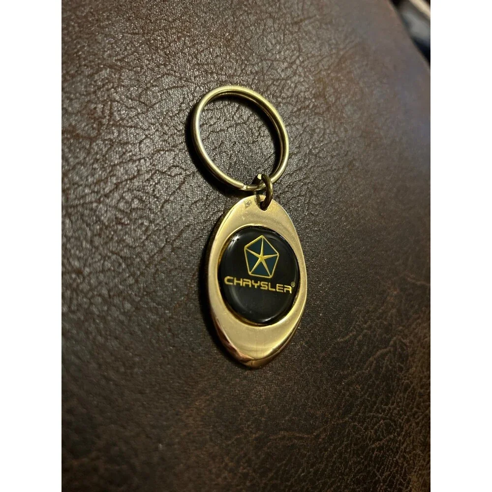 Vintage Chrysler keychain from 1995 gold color